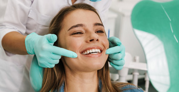 Patient smiling at reflection in mirror