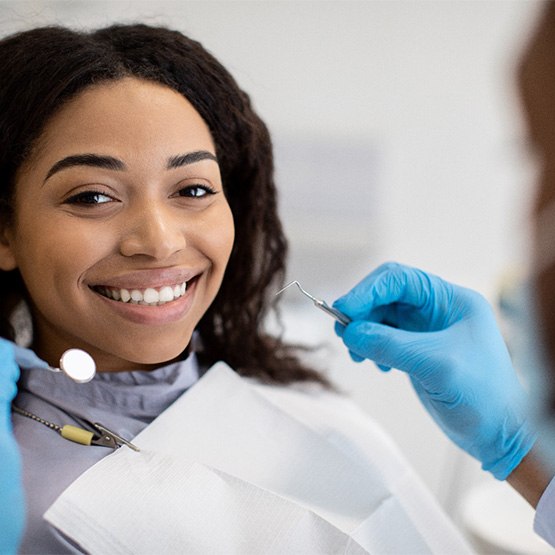 Young woman receiving oral healthcare with dental insurance in Tallahassee