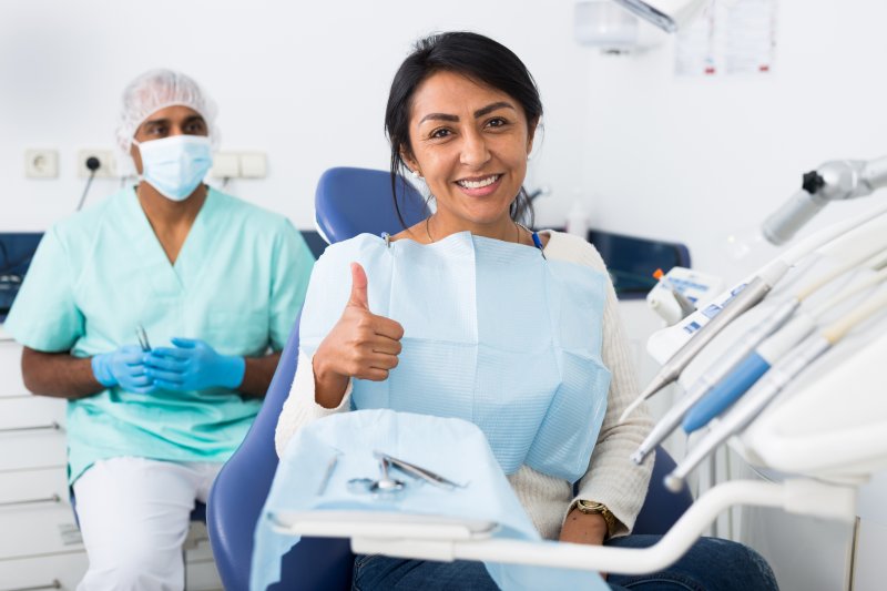 Patient smiling at a dental cleaning