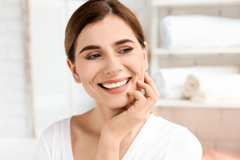 Patient smiling after getting their veneers